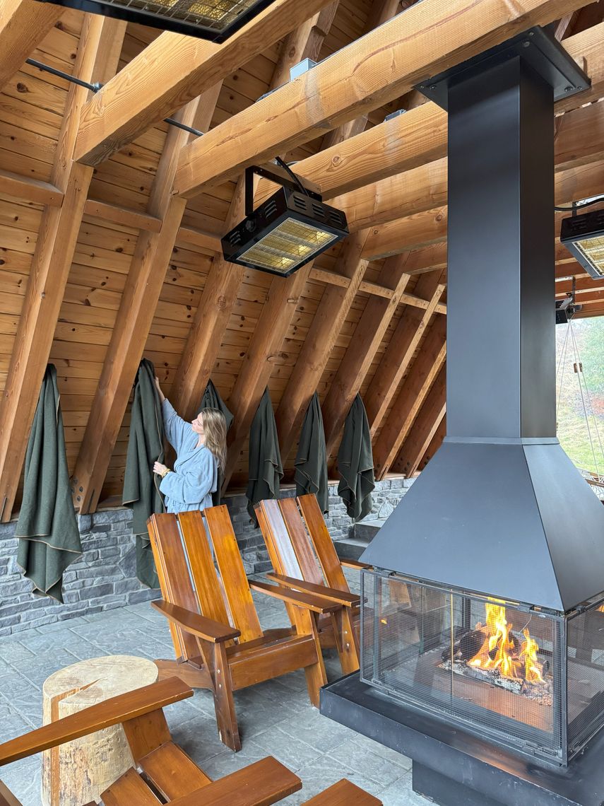 woman hanging a blanket in the a-frame