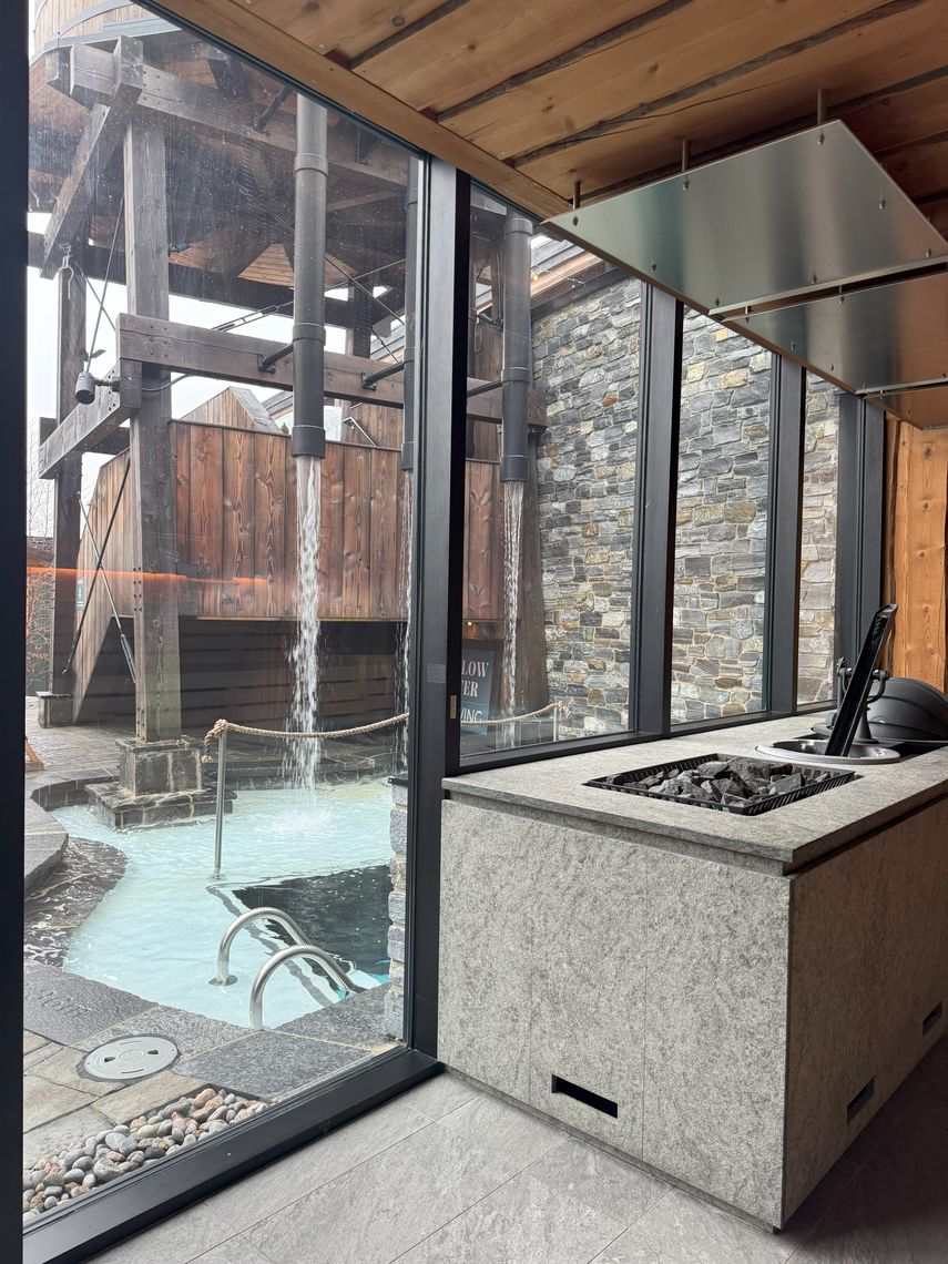 view of the village through the windows of a sauna