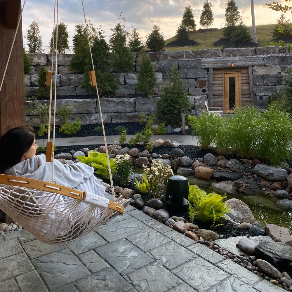 Andrea resting in a hanging chair