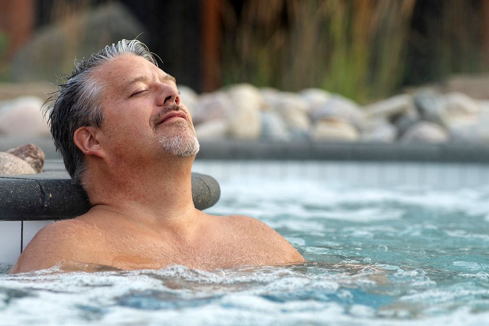 man relaxing in a bath