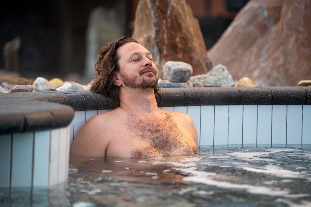 man relaxing in a bath