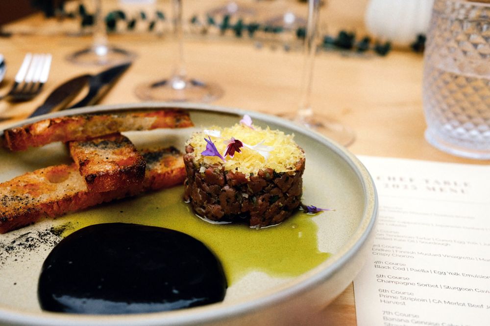 Bison tenderloin tartar, cured egg yolk, juniper ash, roasted kale oil and sourdough
