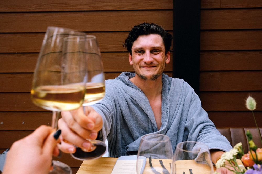 guests holding up glasses of wine