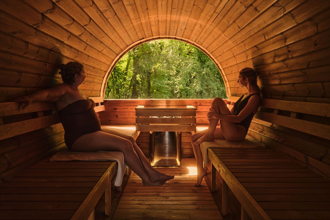mother and daughter inside the new Barik sauna with a window