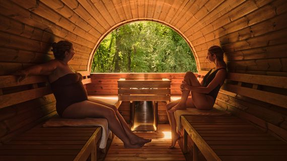 mother and daughter inside the new Barik sauna with a window