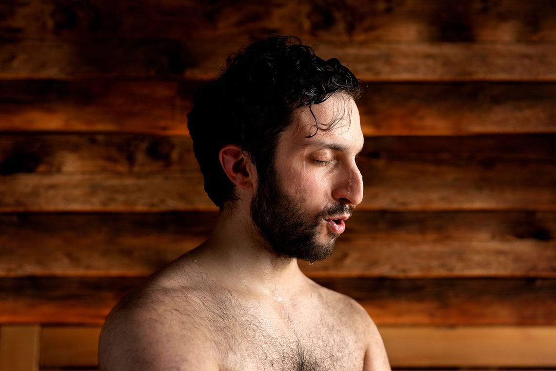 man sweating in sauna