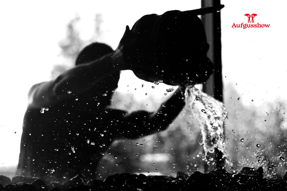 bucket of water spilled on hot rocks