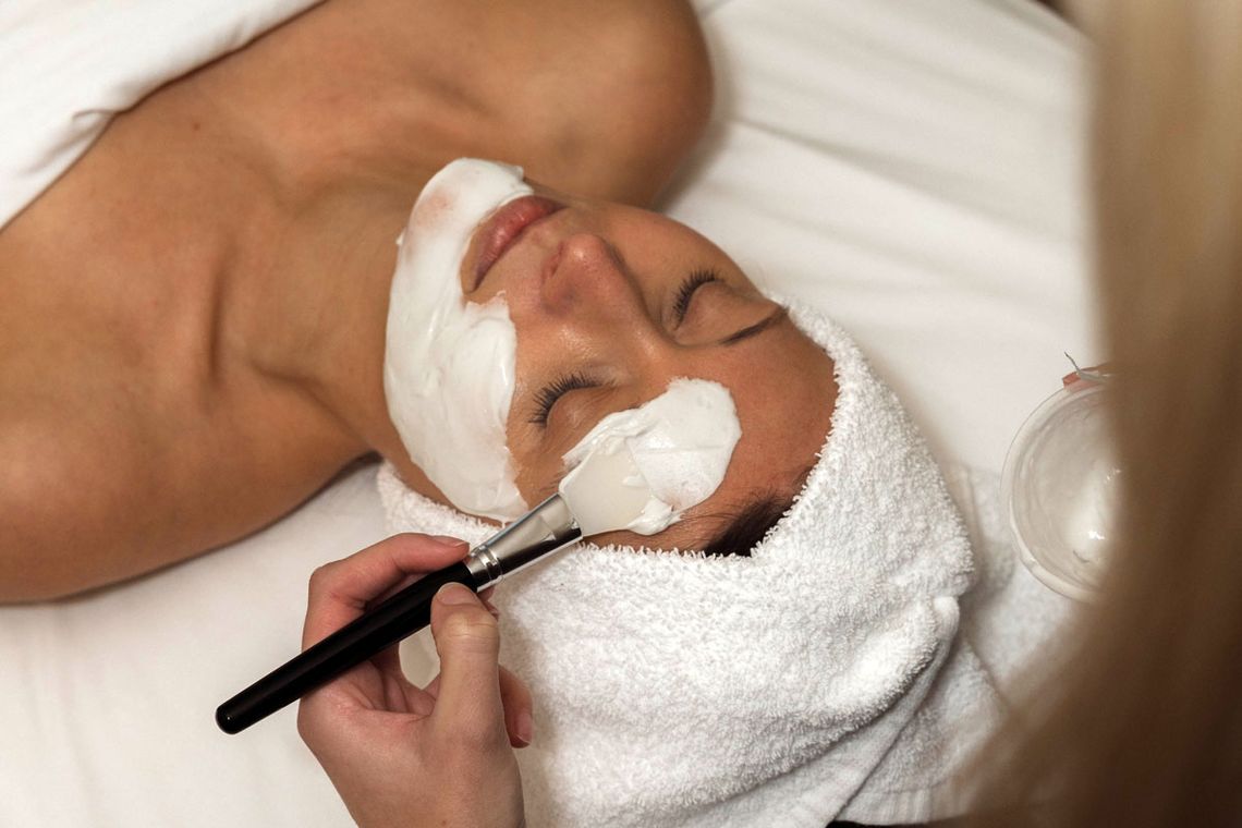 woman enjoying a facial mask