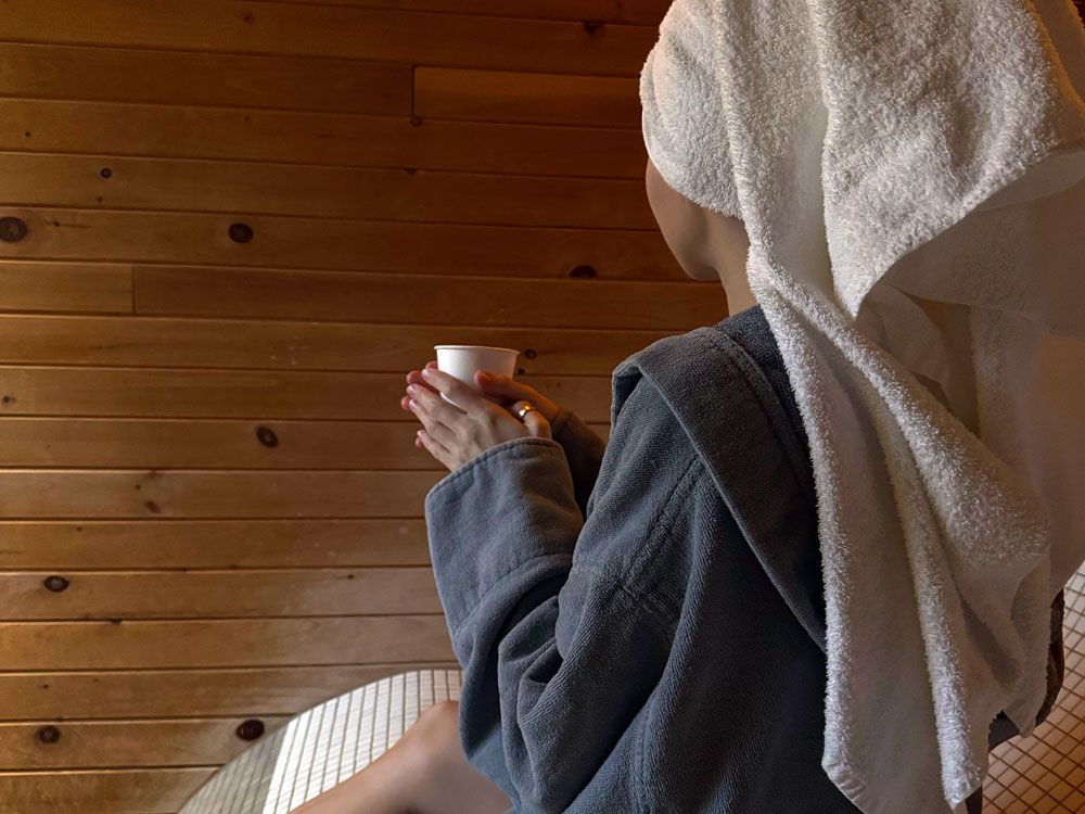 guest having a herbal tea while in an indoor rest area
