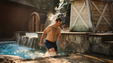 man walking out of a cold plunge
