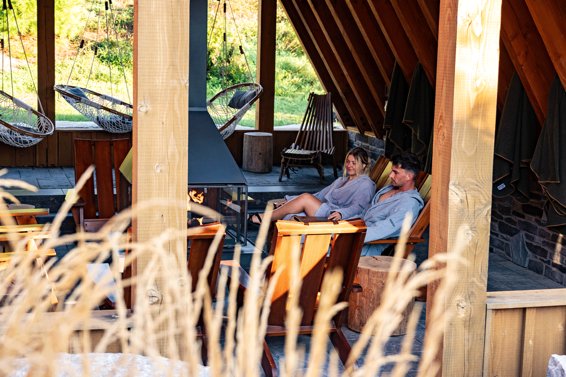 guests resting indoor near a fireplace
