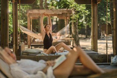woman stretching in the beach area