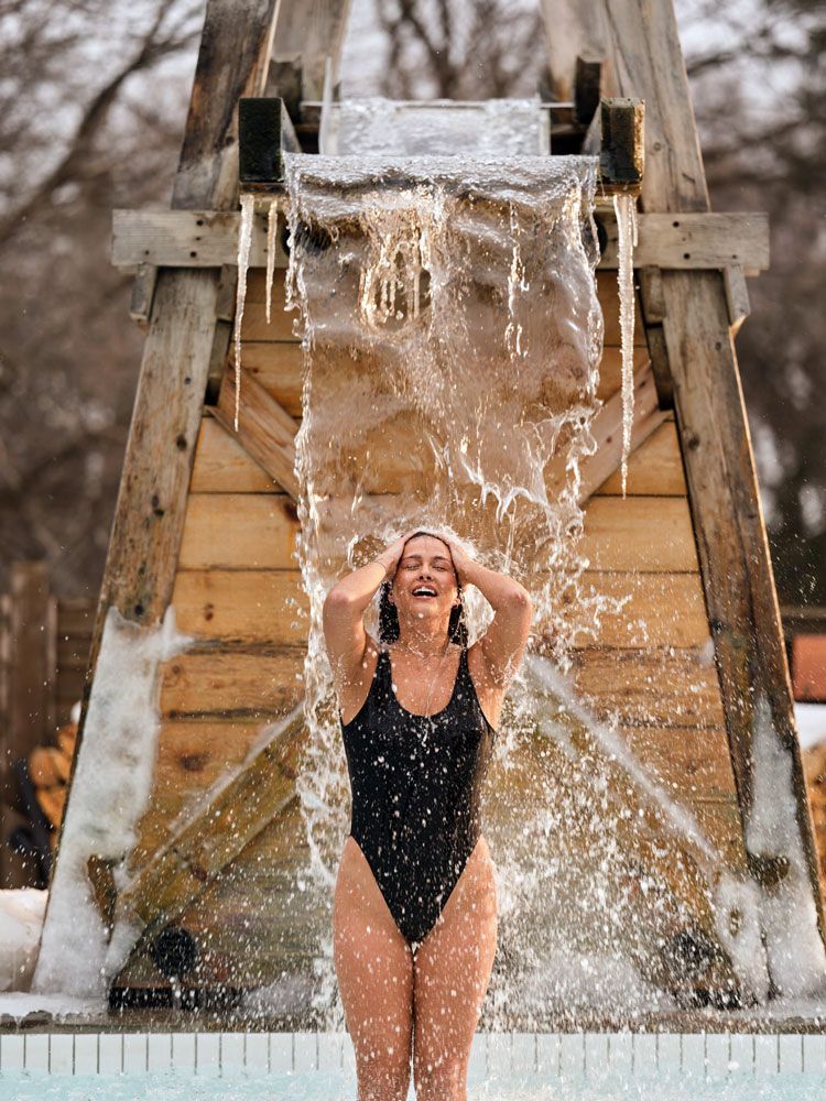 woman under a cold waterfall