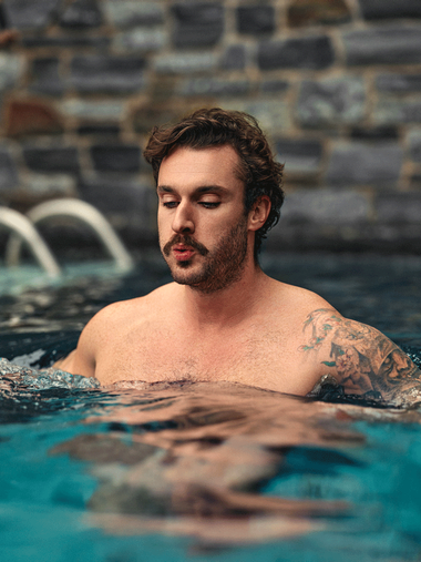 man doing a cold plunge