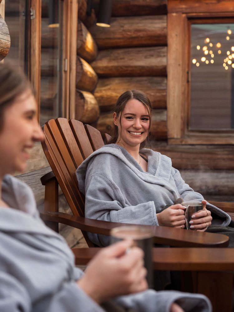 guests relaxing by a fire