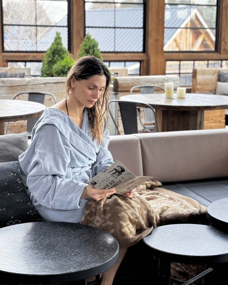 guest reading the Biergarden menu at the Village