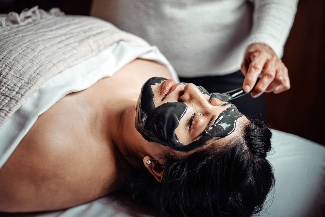 woman with a charcoal mask