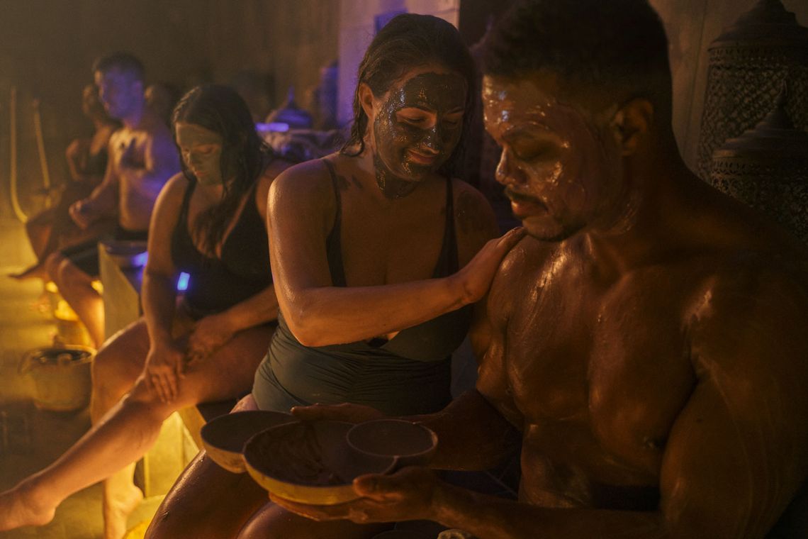 guests applying Rhassoul clay to their skin
