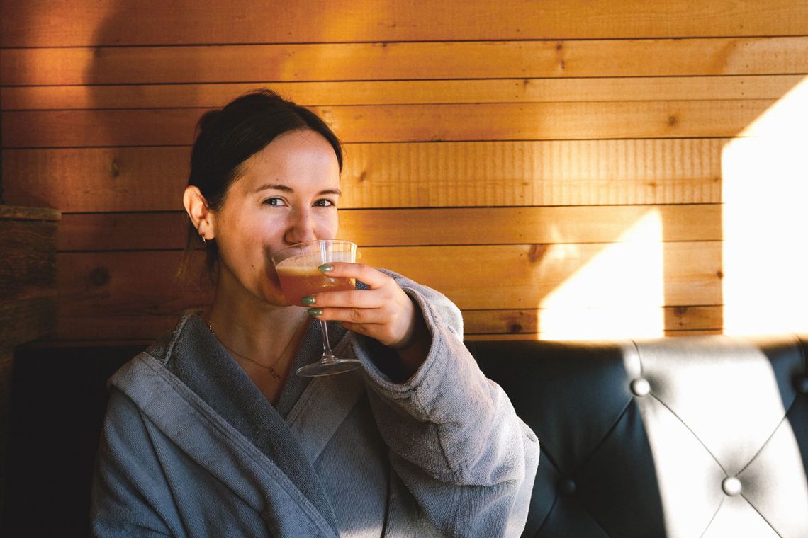 guest having a drink at Le Resto