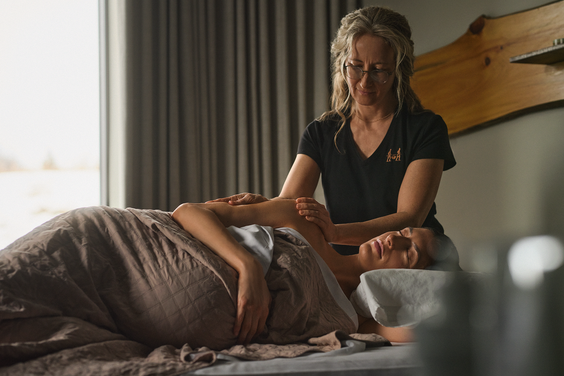 pregnant woman receiving a massage