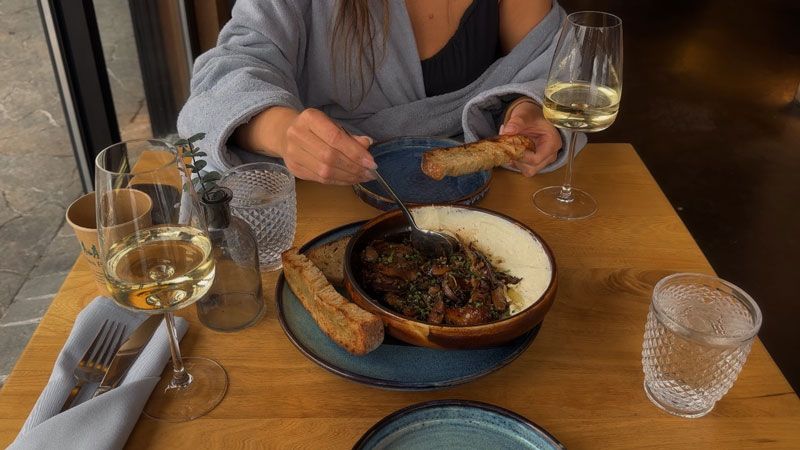 Saige enjoying a meal at Le Resto