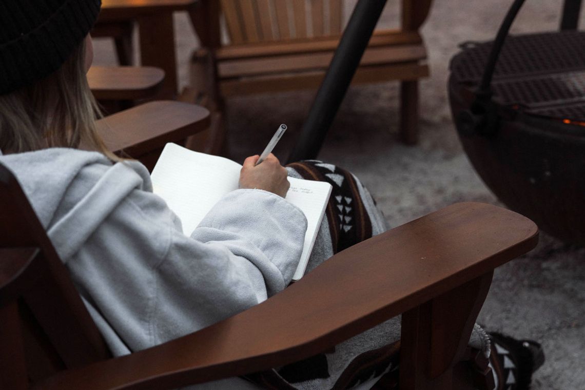 woman journaling at the spa