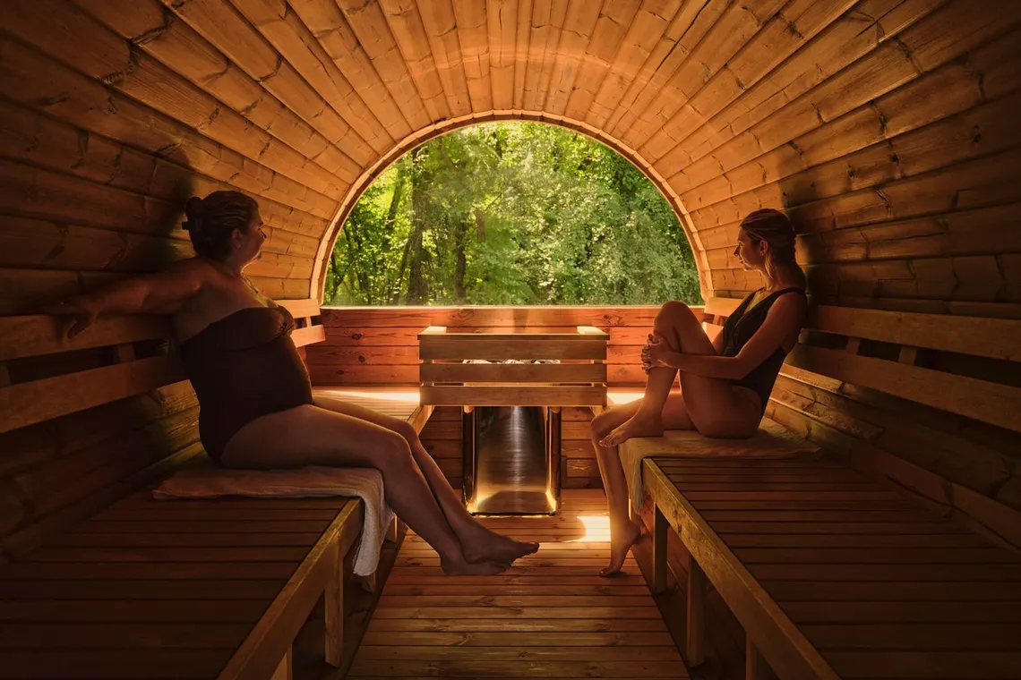 mother and daughter inside the new Barik sauna with a window