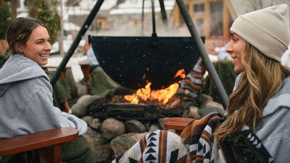 guests sitting around a fireplace