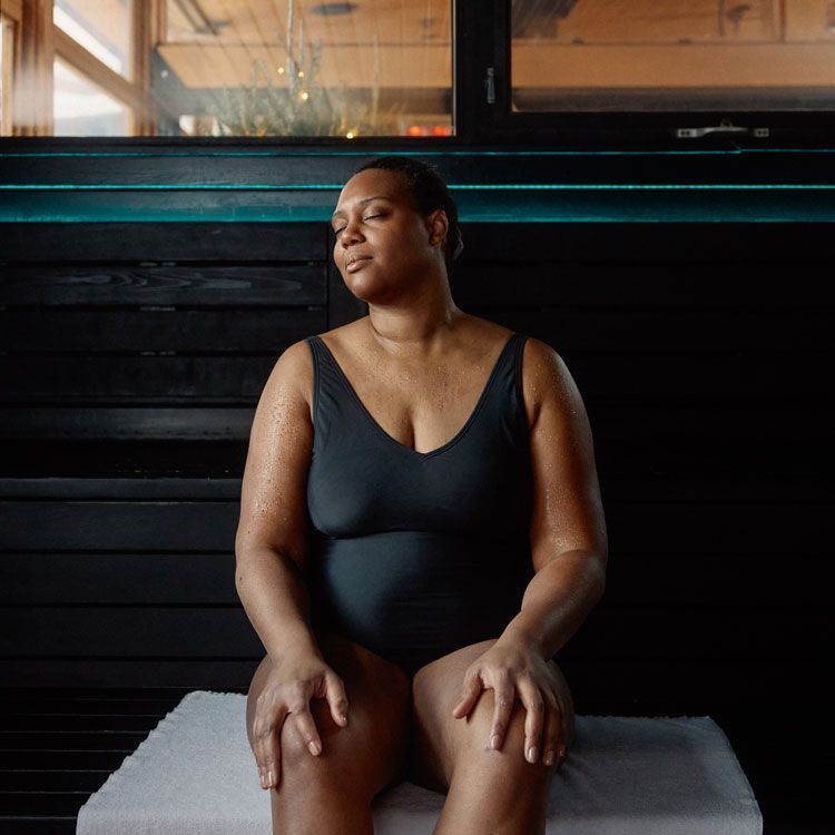 woman sweating in an aromatic sauna