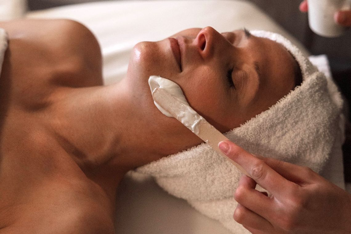 woman enjoying a facial mask